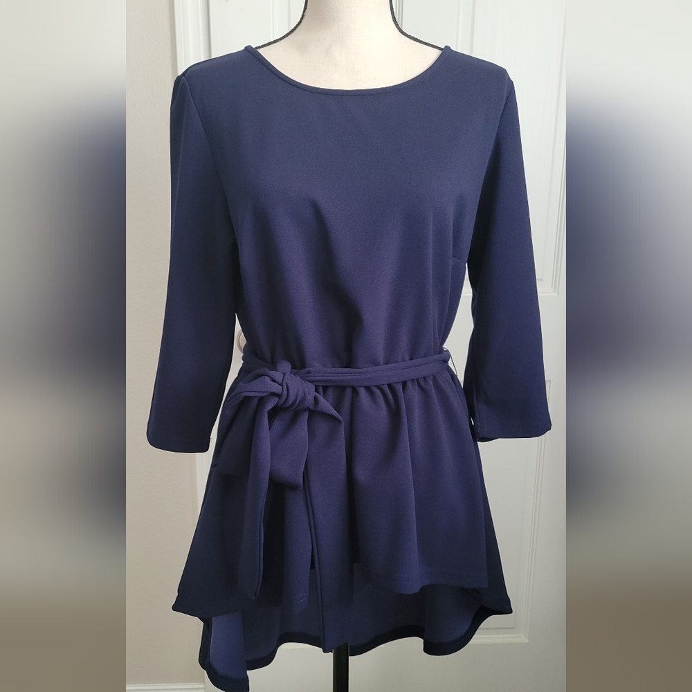 Blouse with tie-around waist.